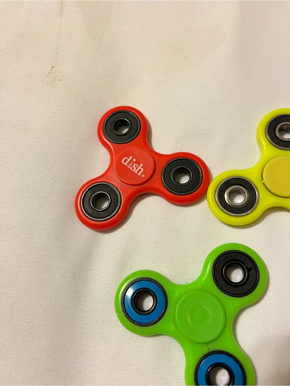 Lot of 3 Fidget Spinners ESPN Dish Network Plastic Toy Red Green Yellow